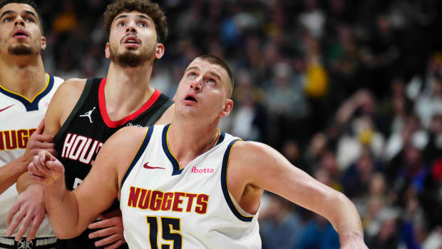 Nuggets center Nikola Jokic and forward Michael Porter Jr. (1) and Houston Rockets center Alperen Sengun (28) during the first quarter at Ball Arena